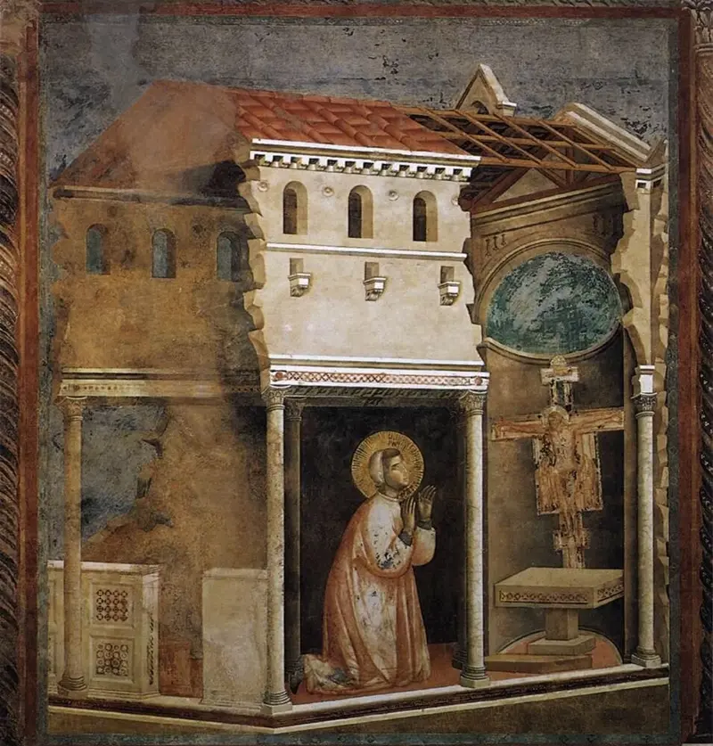 Fresko: Franziskus kniet betend in der halb verfallenen Kirche San Damiano vor dem großen Kreuz.